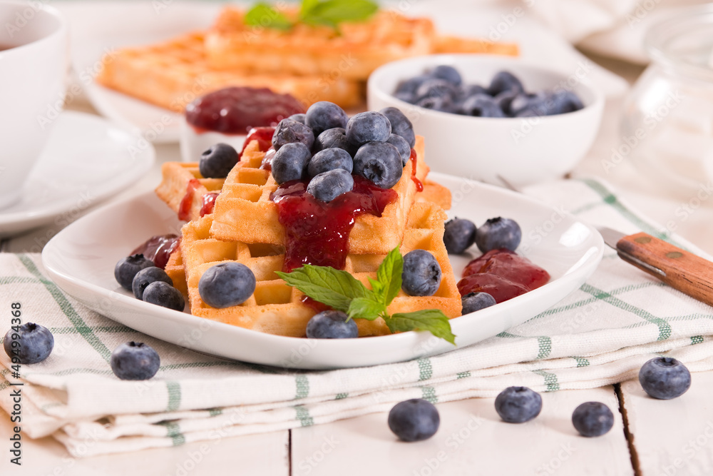 Waffles with blueberries and jam. Waffles with blueberries and jam.