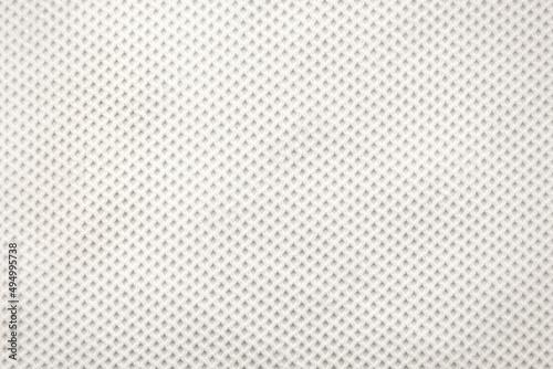 Background from mesh white fabric. Light shade material with small lines. pattern