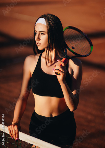  The girl tennis player plays sports on the tennis court