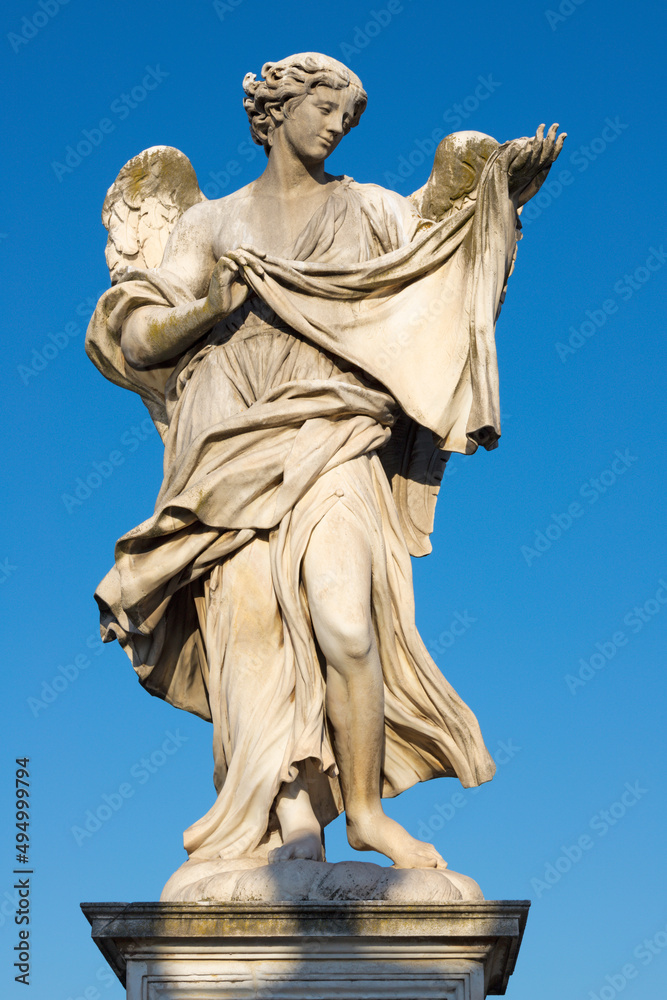 ROME, ITALY - SEPTEMBER 1, 2021: The statue of Angel with the Sudarium on the Ponte Sant'Angelo by Cosimo Fancelli (1620  - 1688).