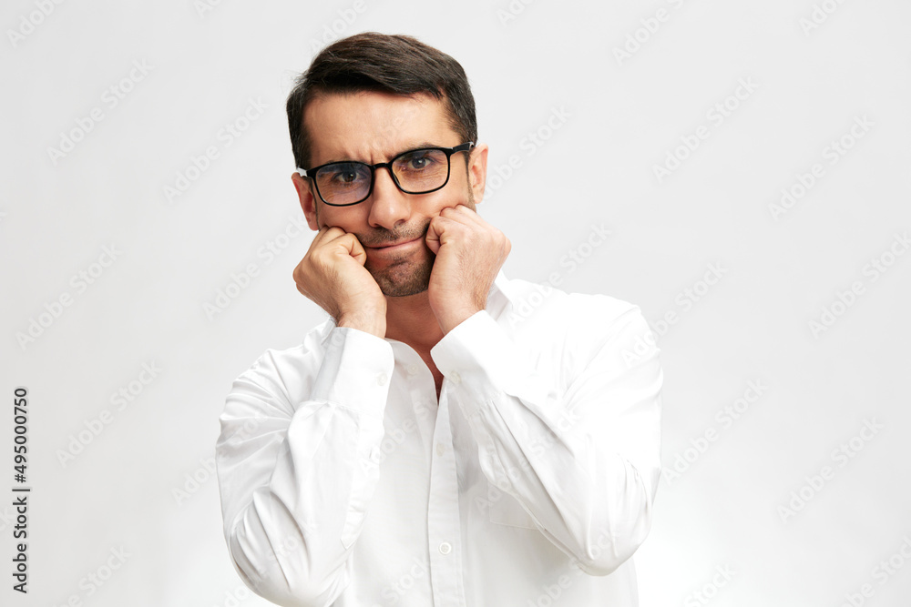 handsome man in a white shirt, glasses, a pensive look, self-confidence isolated background handsome man in a white shirt, glasses, a pensive look, self-confidence isolated background