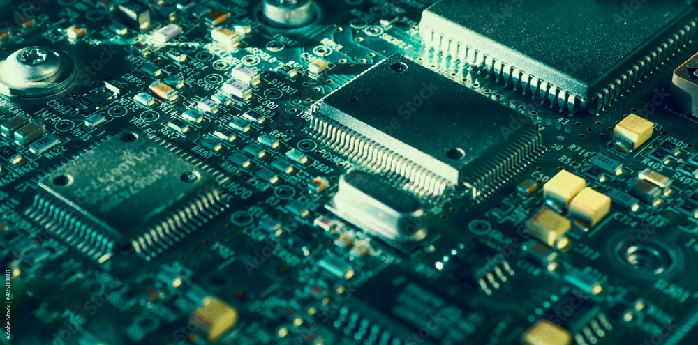 Computer Microchips and Processors on Electronic circuit board. Computer hardware technology. Abstract technology microelectronics concept background. Macro shot, shallow focus. Computer Microchips and Processors on Electronic circuit board. Computer hardware technology. Abstract technology microelectronics concept background. Macro shot, shallow focus.