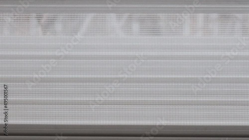 the roller blind of a window opens
