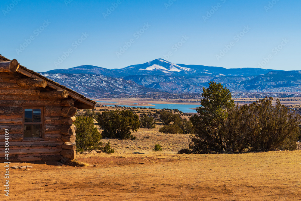 view from old cabin at Ghost Ranch of Abiquiu Lake and snowy mountain landscape
view from old cabin at Ghost Ranch of Abiquiu Lake and snowy mountain landscape
