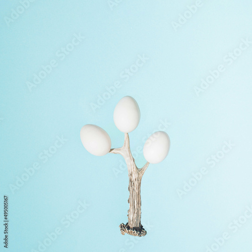 Easter eggs on a tree.Silver branch and light blue design