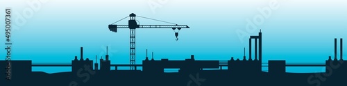 Silhouette of unfinished construction with industrial crane. 