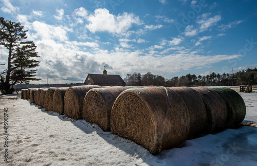 Round Hay Bales Barn in Background