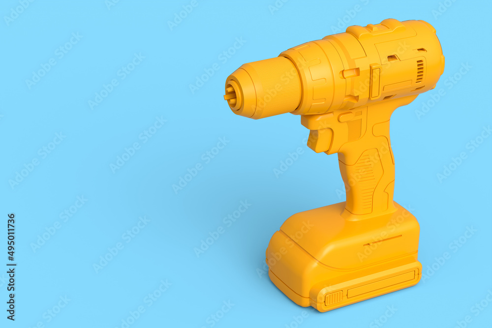 Cordless drill or screwdriver isolated on blue monochrome background Cordless drill or screwdriver isolated on blue monochrome background