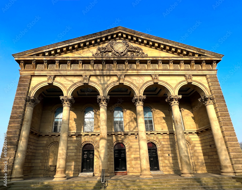 Magnificent Victorian stone building, with columns and arches, set against a blue sky on, Bradford Road, Cleckheaton, UK