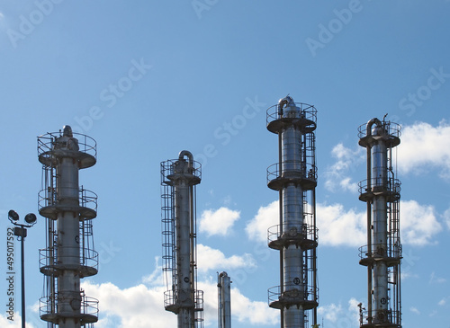 tall steel fractionation or cooling towers at a large industrial chemical plant