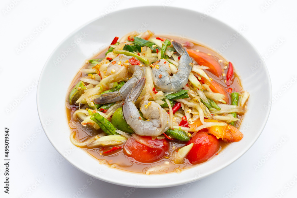Papaya salad with shrimp in white plate