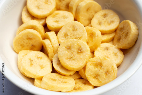 Banana slices iin white bowl