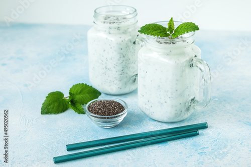 Tasty yogurt or smoothie with chia and mint, vegetarian food