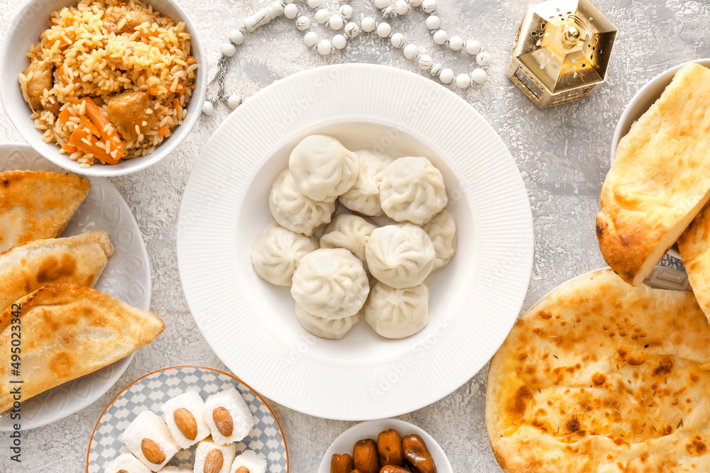Traditional Eastern dishes on grunge background, top view