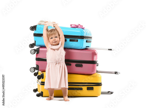 Cute baby girl with suitcas...