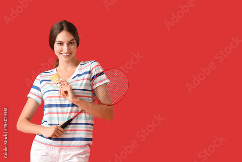 Sporty female badminton pla...