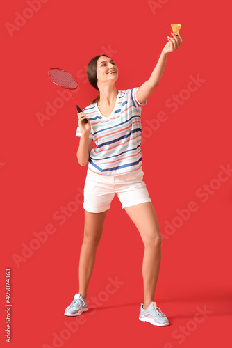 Sporty female badminton pla...