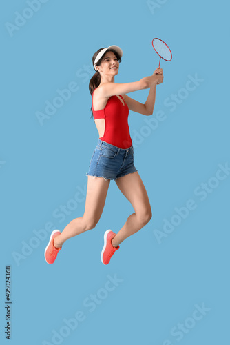Sporty female badminton pla...