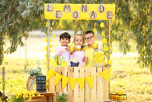 Cute children selling lemon...