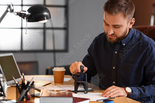 Male notary public attachin...
