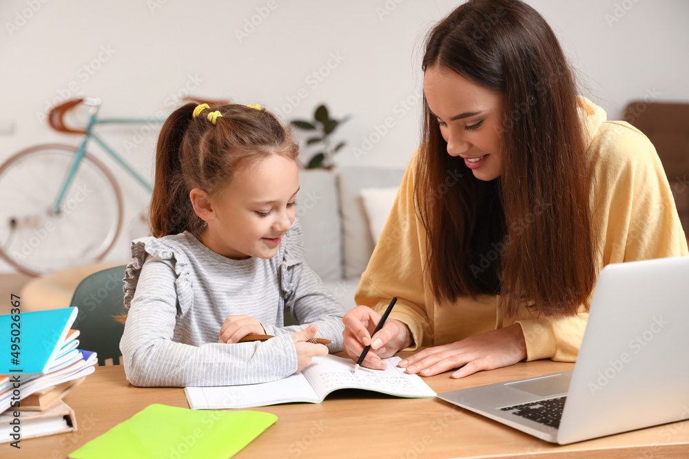 Cute girl studying with tutor at home - obrazy, fototapety, plakaty 