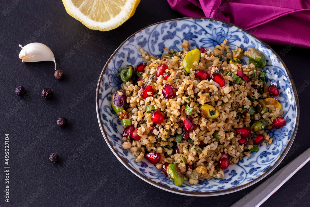 Freekeh, pomegranate seeds and pistachio healthy salad. Arabic, African and Arabic traditional cuisine. Copy space. Superfood concept. Freekeh, pomegranate seeds and pistachio healthy salad. Arabic, African and Arabic traditional cuisine. Copy space. Superfood concept.