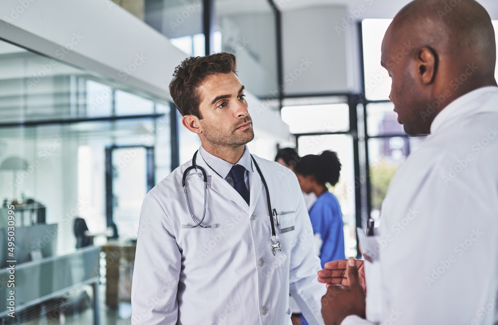 Double the doctoring expertise. Shot of two doctors having a discussion in a hospital. Double the doctoring expertise. Shot of two doctors having a discussion in a hospital.