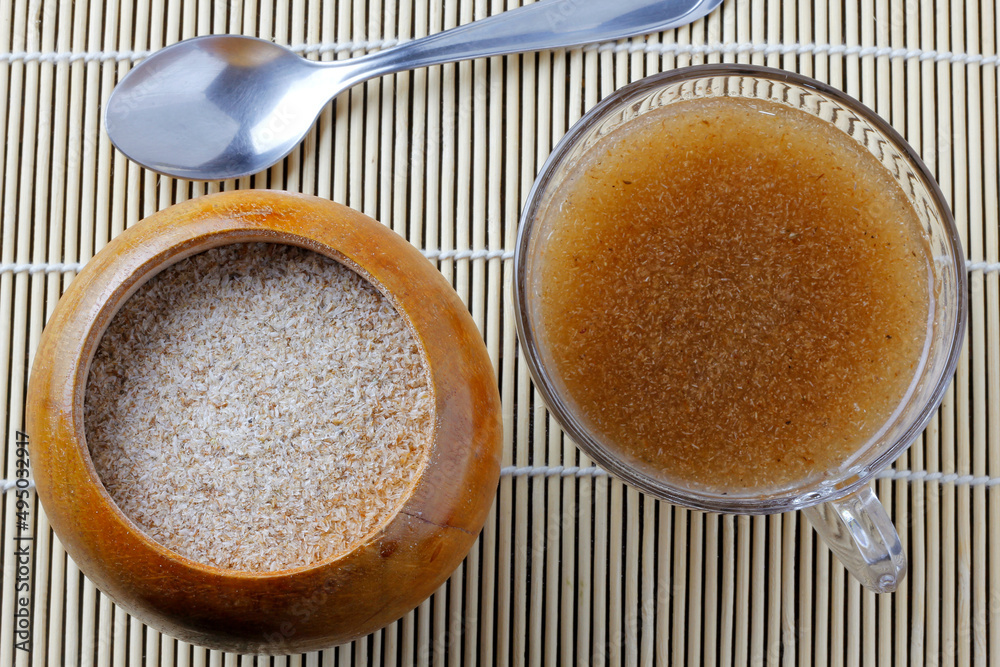 Psyllium husk fiber mixed with water in the glass cup forming gel Stock Photo Adobe Stock
