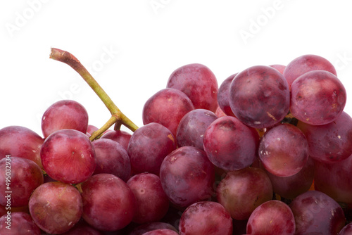 Red grapes photographed in a studio on a white background.