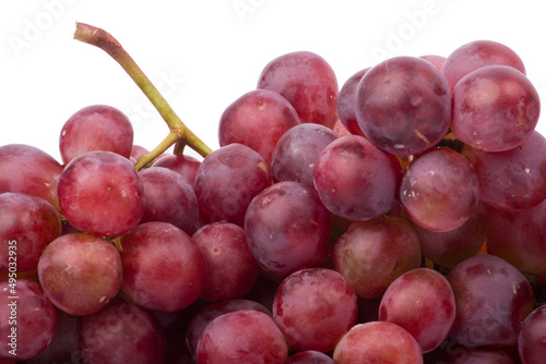 Red grapes photographed in a studio on a white background.