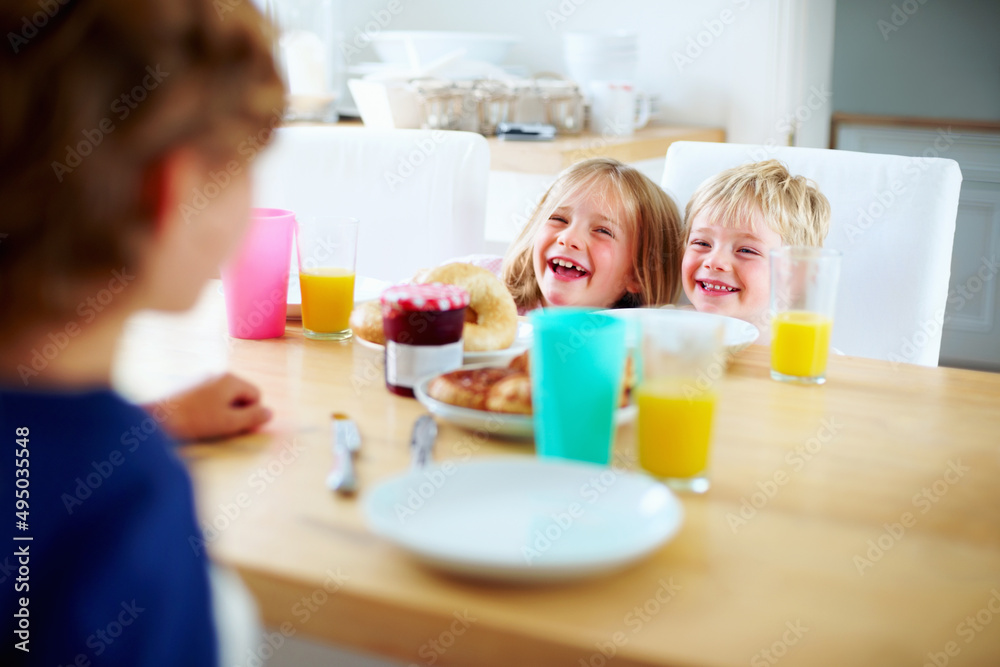 Cheerful young kids having fun during their breakfast. portrait of a cheerful young kids having fun during their breakfast. Cheerful young kids having fun during their breakfast. portrait of a cheerful young kids having fun during their breakfast.