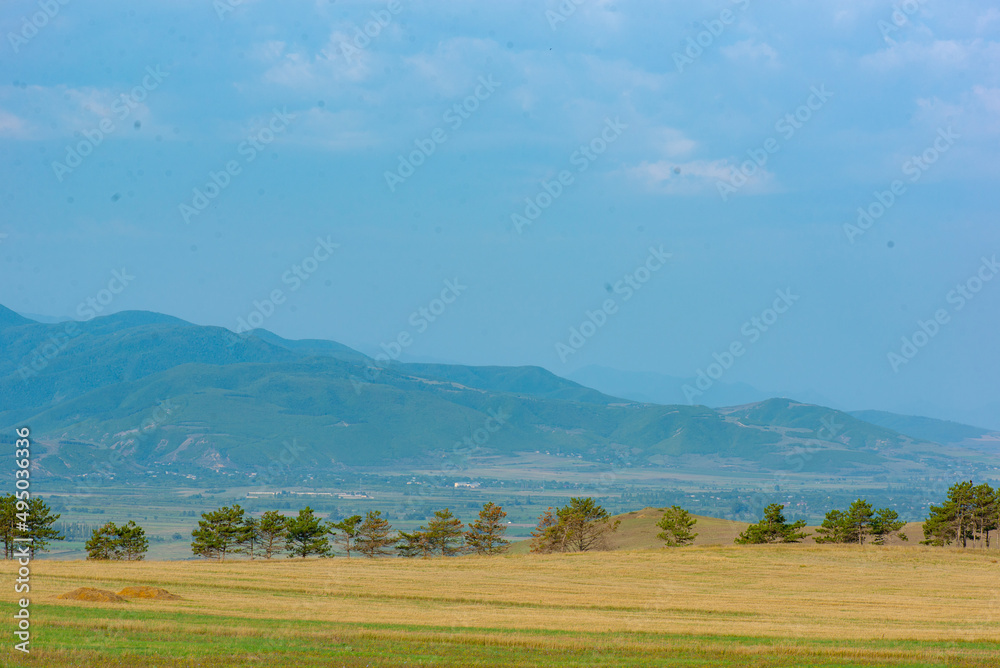 Obraz premium blue sky and mountainous landscape in georgia in summer