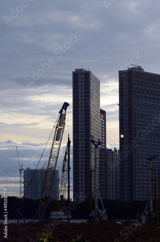Construction works with Skyscraper Buildings background at afternoon