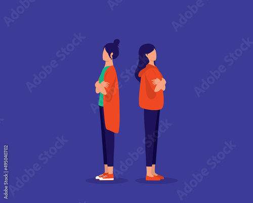 Two Young Woman Standing Back To Back With Arm Crossed Unfriend With Each Other.