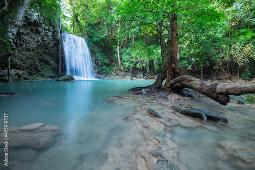 Fototapeta Naklejka Na Ścianę i Meble -  Beautiful Erawan tropical waterfall in Kanchanaburi province, Thailand. Travel in Nature concept.