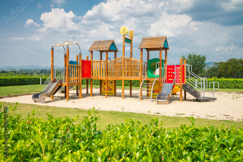 Colorful outdoor children playground in sunny day blue sky background. Kid learning and development concept. photo