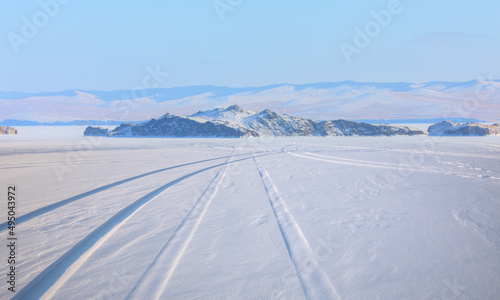 Car tire tracks (trail) in fresh snow - Baikal Lake, Siberia 