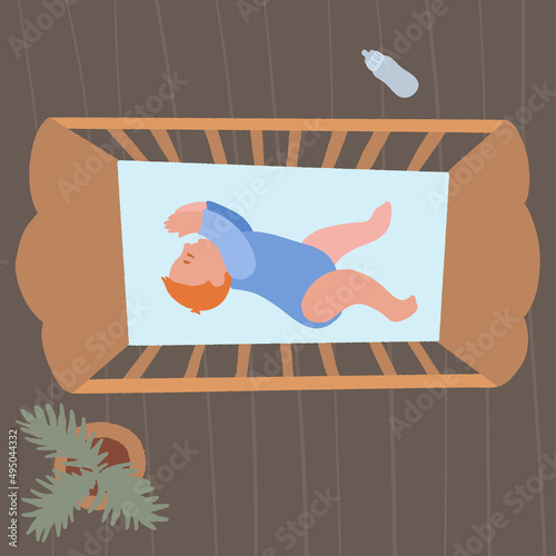 Cute little baby in crib. Infant in bed sleep peacefully. Healthy sleep at night.