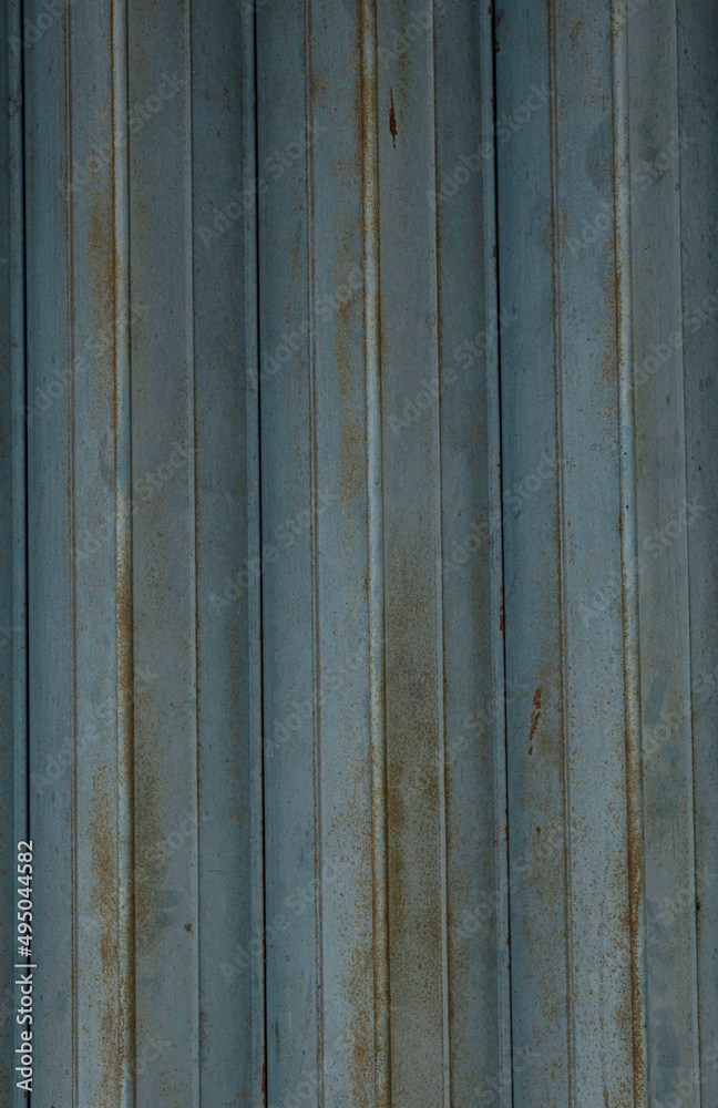 Obraz premium Vertical rusted corrugated metal surface texture