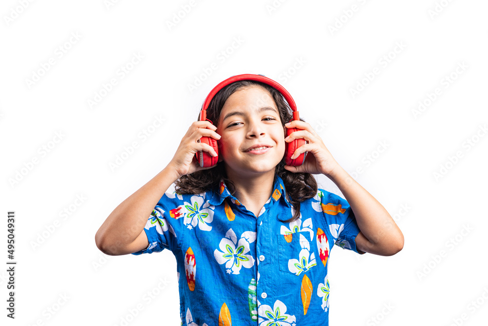 Horizontal portrait of a child putting on headphones on a white background. Horizontal portrait of a child putting on headphones on a white background.