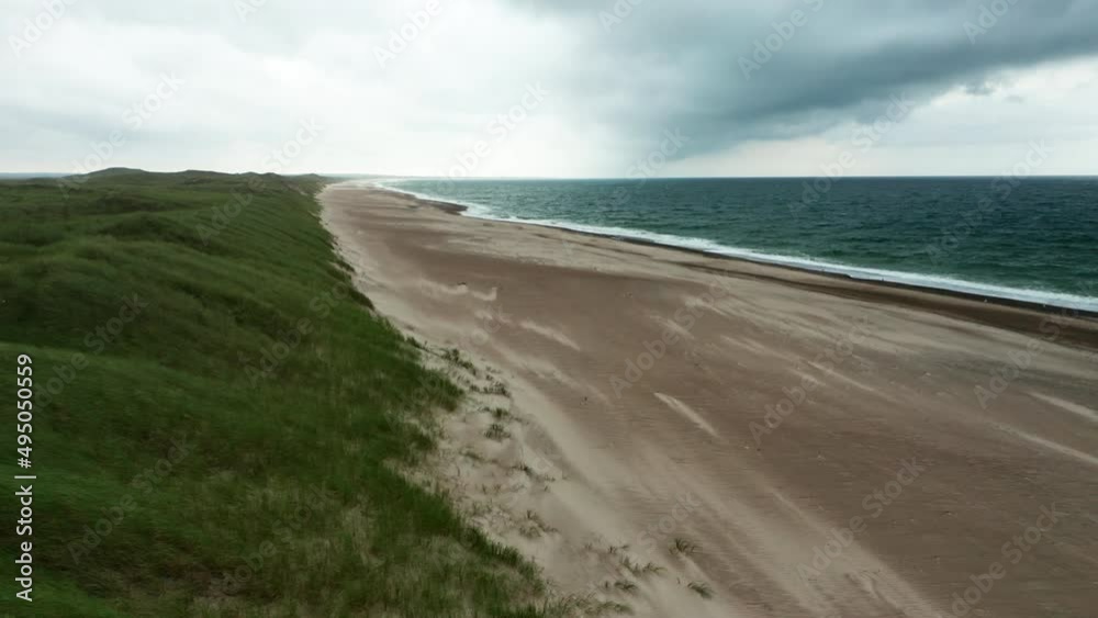 Drone Over Grass And Sandy Beach Of Jutland Coastline With Horizon Drone Over Grass And Sandy Beach Of Jutland Coastline With Horizon