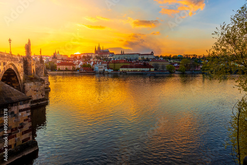 One of the most famous Prague views of the Hradčany skyline, which is taken from Charles Bridge at sunset, which sets directly behind the castle.