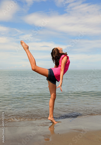 little girl on seashoe during workout photo