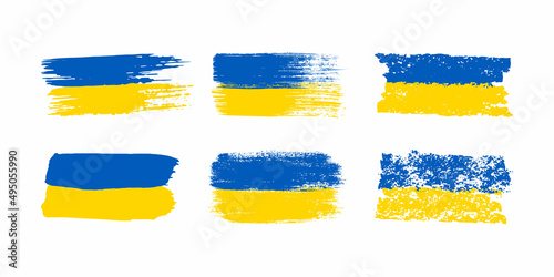Set of Ukrainian flags in grunge style. Blue and yellow brush strokes isolated on white background. Vector illustration