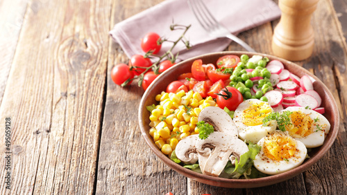 vegetable salad with tomato,  egg,  corn and radish