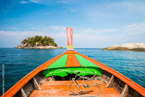 Beautiful tropical island south Andaman with blue sky view from traditional fishing boat, Satun Thailand. Tropical summer holiday concept. photo