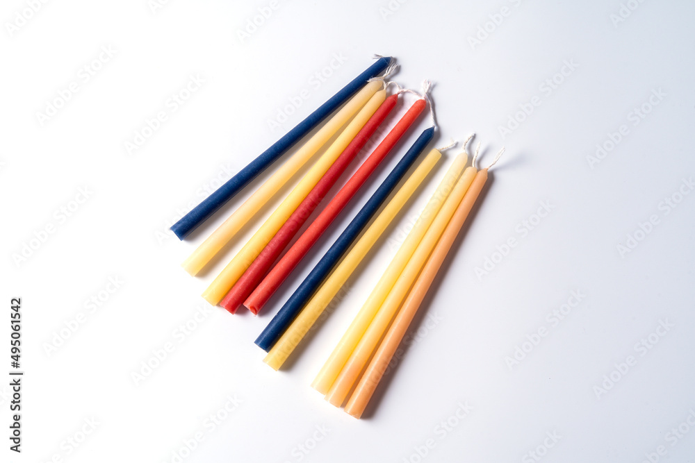 Festive composition with traditional Jewish candles for the Hanukkah holiday on white background. Festive composition with traditional Jewish candles for the Hanukkah holiday on white background.