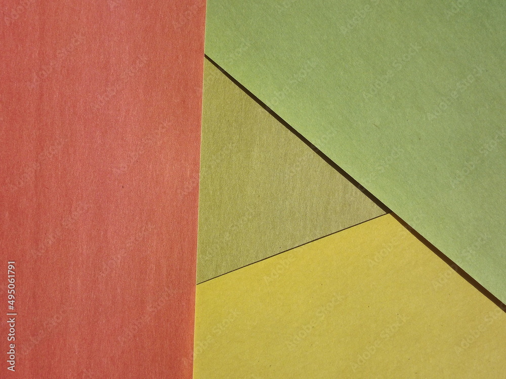 Background surface made of green and red paper Background surface made of green and red paper