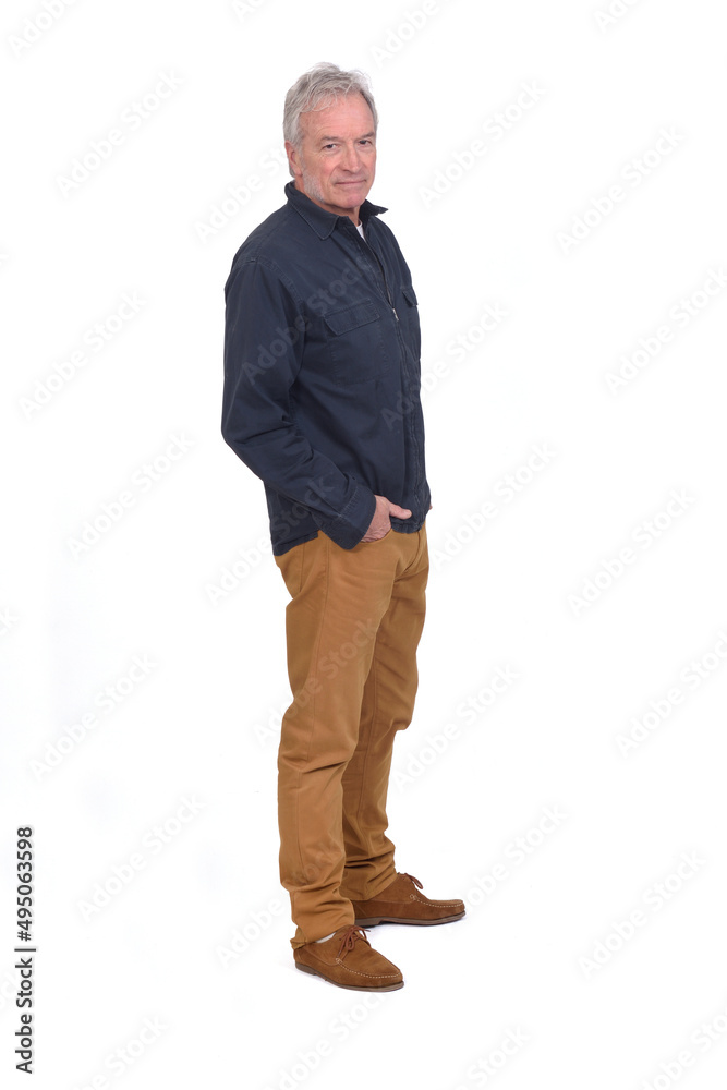 side view of a man hands on pockets and looking at camera on white background side view of a man hands on pockets and looking at camera on white background