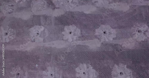 Blasting holes at open pit coal mine. Aerial footage  preparing for blasting in quarry mining coal. Drone view of explosive works on open pit. 